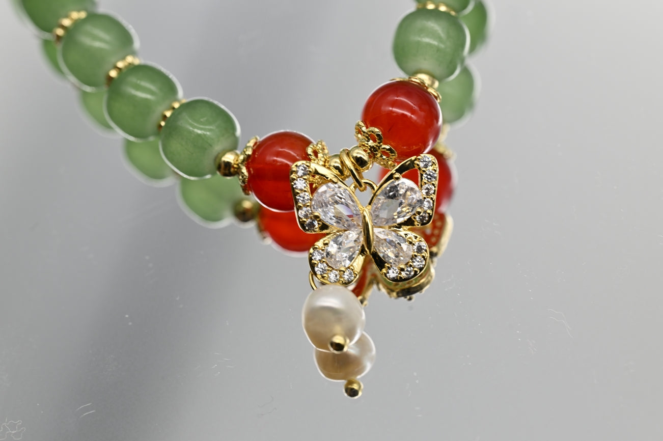 Green Beaded Bracelet with Butterfly Charm
