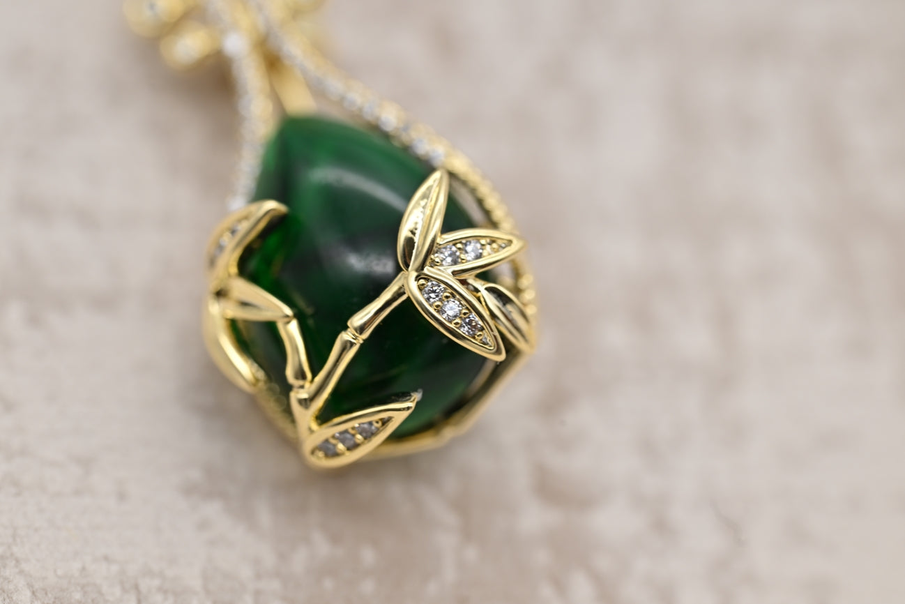 Vintage Green Gem Brooch with Floral Accents
