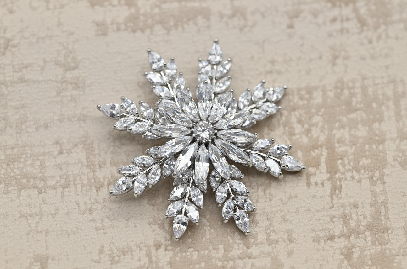 Elegant Snowflake Crystal Brooch in Silver