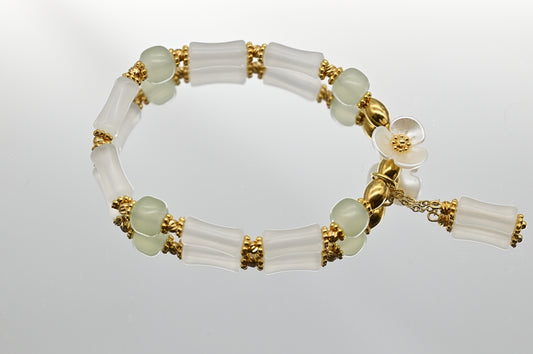 White and Green Beaded Bracelet with Flower Charm