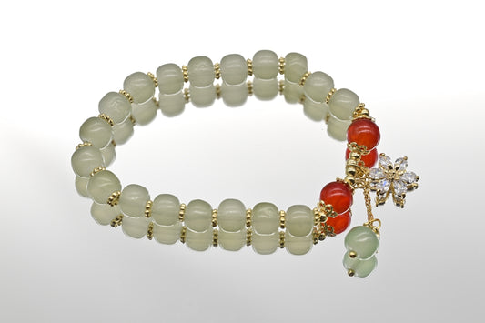Green and Red Beaded Bracelet with Floral Charm