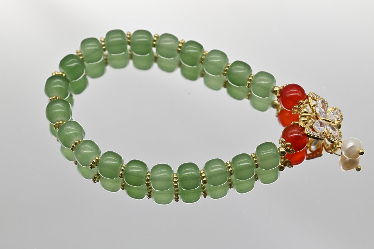 Green Beaded Bracelet with Butterfly Charm