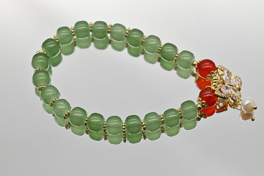 Green Beaded Bracelet with Butterfly Charm