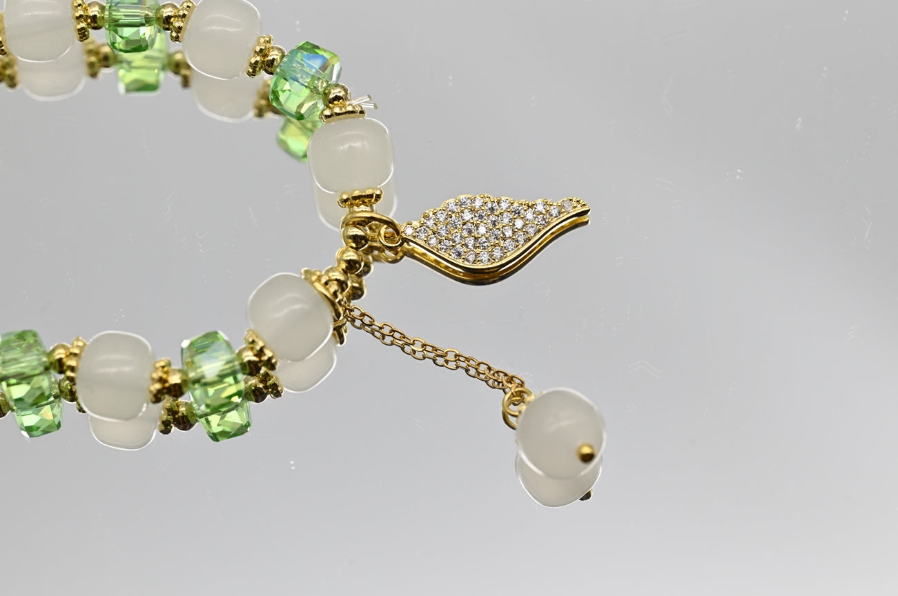Green and White Beaded Bracelet with Gold Accents