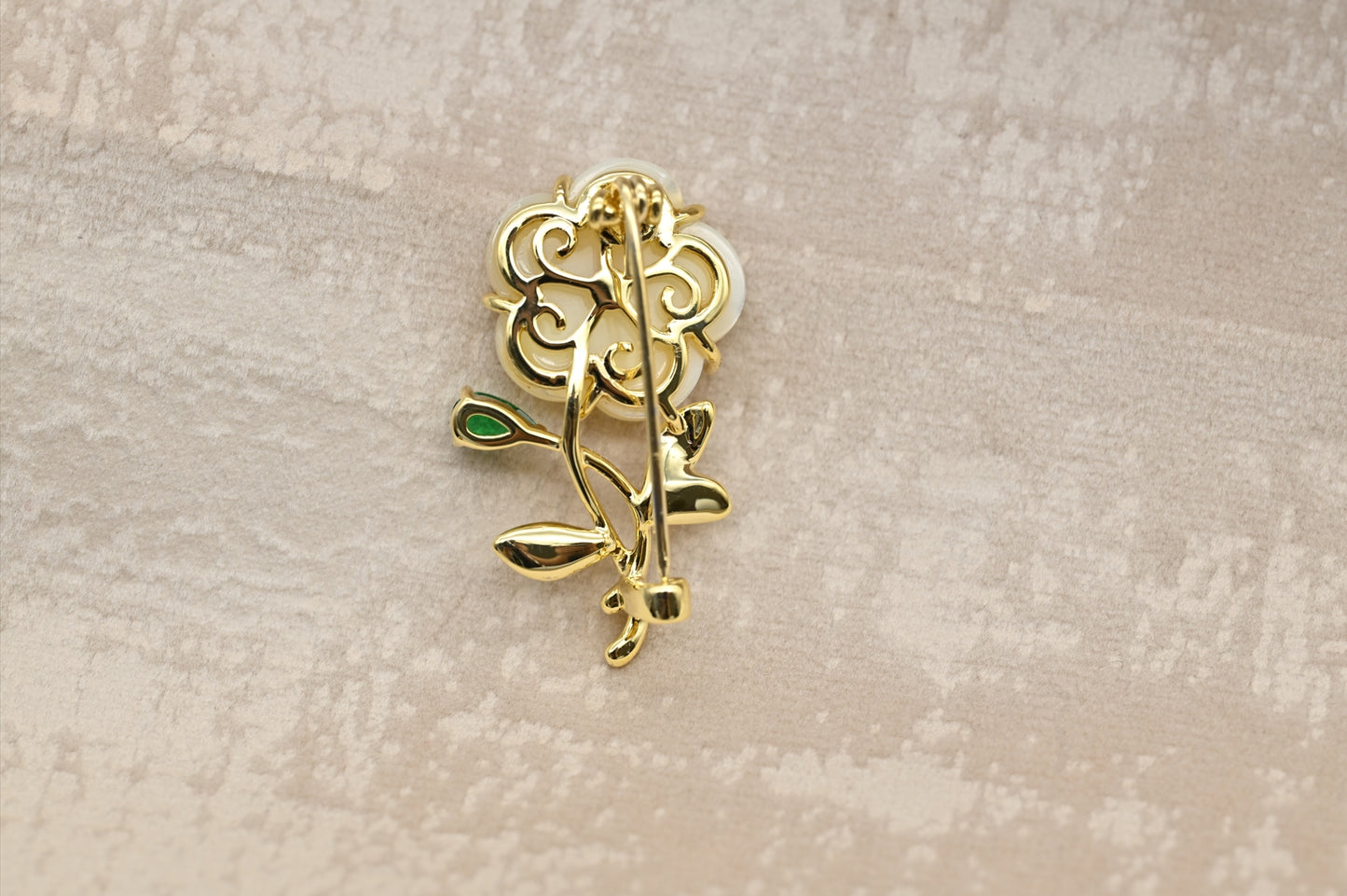 Mother-of-Pearl Flower Brooch with Green Gemstone Accent