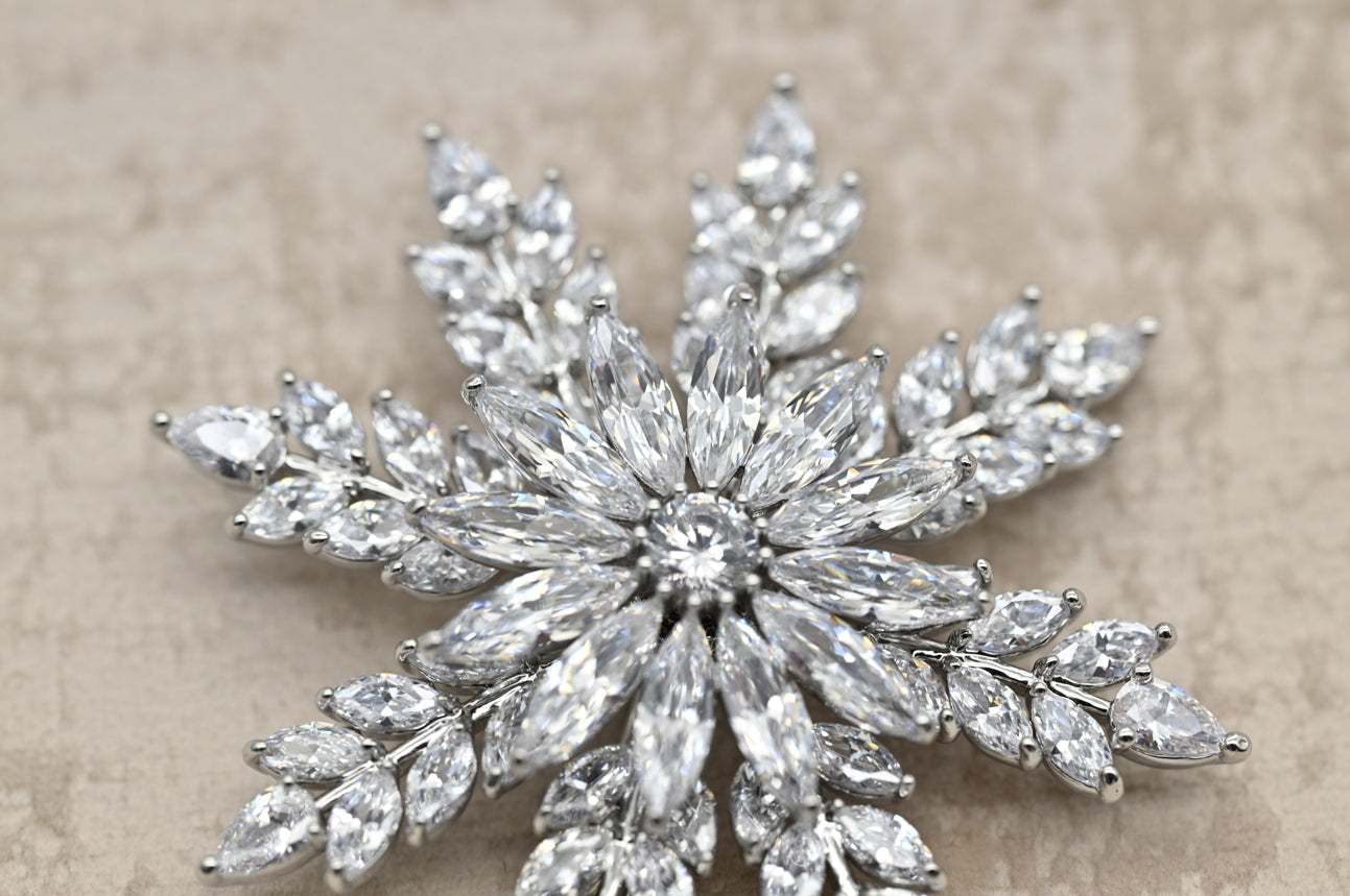 Elegant Snowflake Crystal Brooch in Silver
