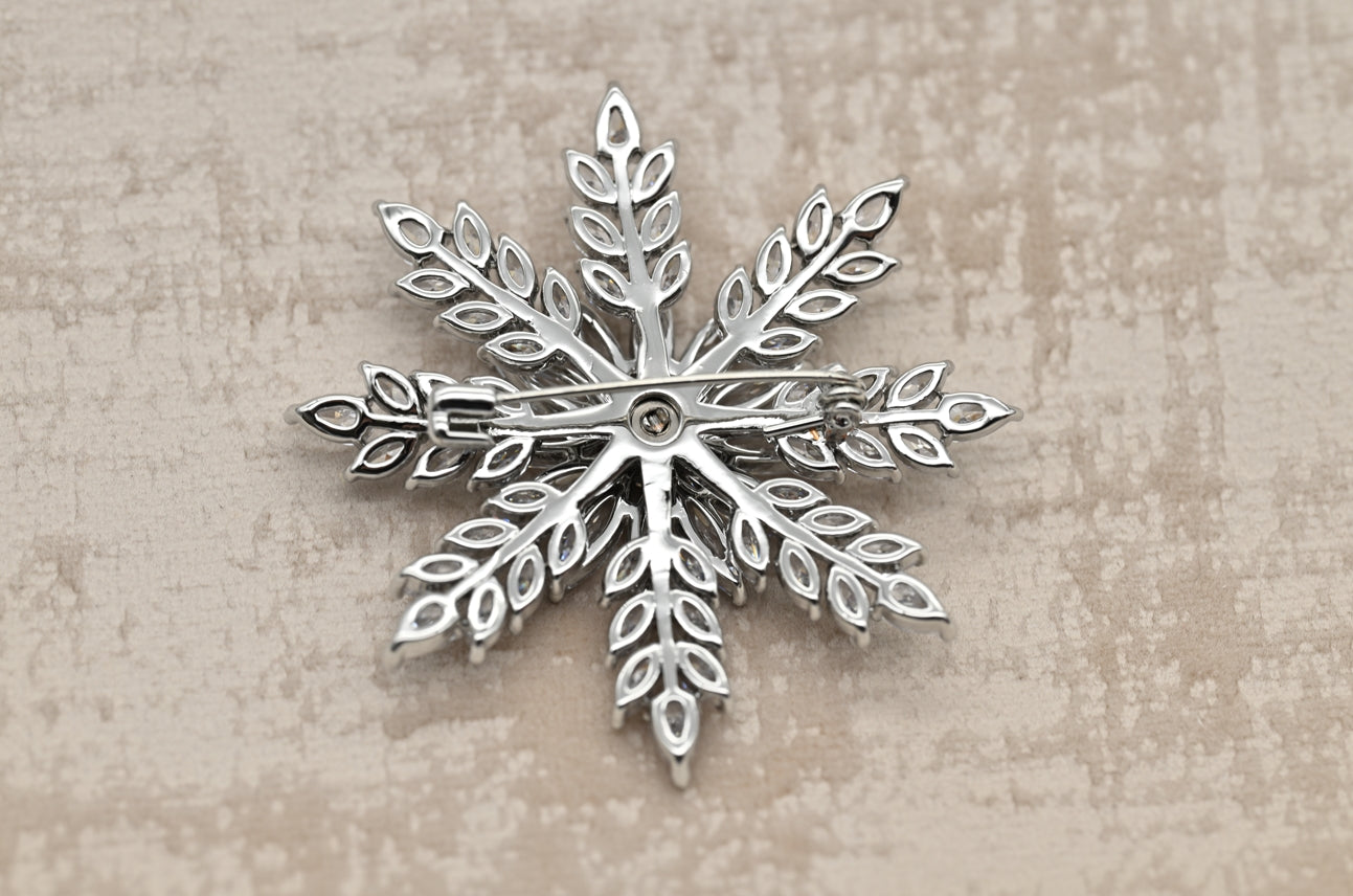 Elegant Snowflake Crystal Brooch in Silver