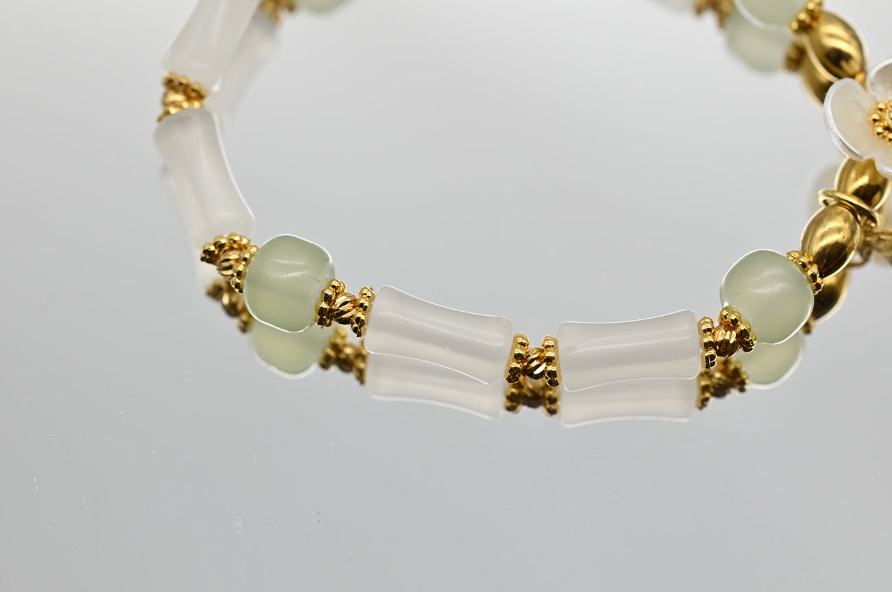 White and Green Beaded Bracelet with Flower Charm