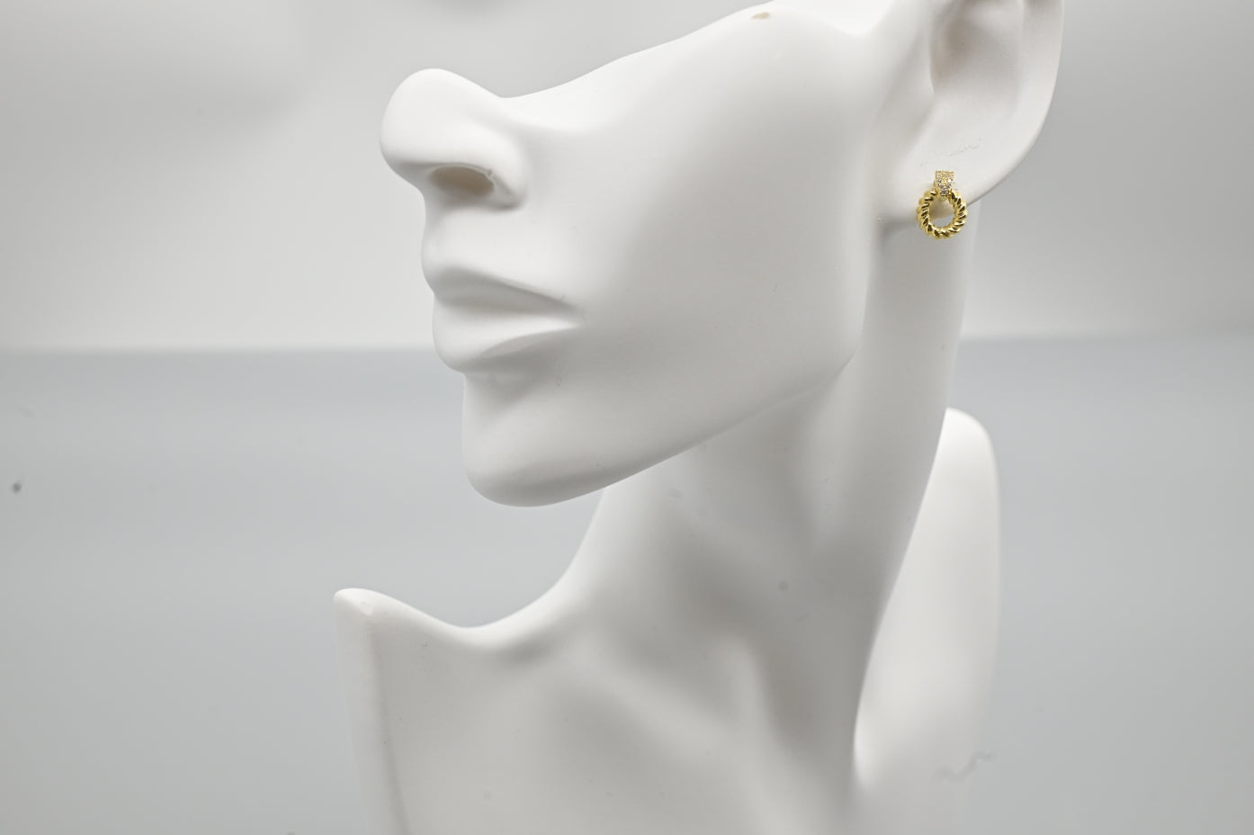 Chic Gold-Plated Twisted Hoop Earrings with Cubic Zirconia